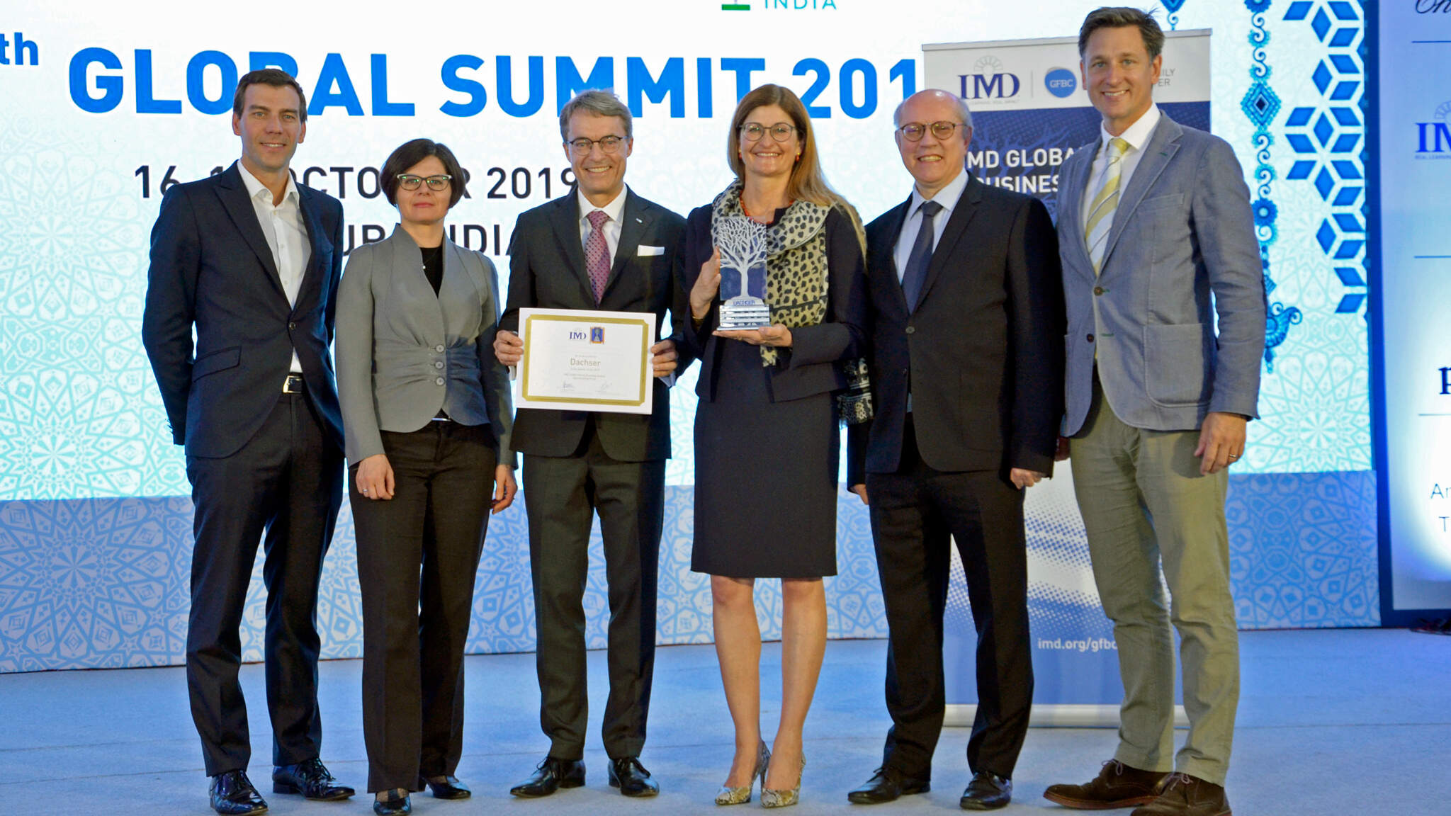 Prof. Peter Vogel, Director of IMD Global Family Business Center; Marta Widz, IMD Research Fellow; Bernhard Simon, CEO DACHSER SE; Birgit Kastner-Simon, Corporate Director Corporate Marketing, DACHSER SE; Prof. Benoit Leleux, IMD Global Family Business Award Director; Matthew Crudgington, Associate Director, IMD Global Family Business Center. Prof. Peter Vogel, Director of IMD Global Family Business Center; Marta Widz, IMD Research Fellow; Bernhard Simon, CEO DACHSER SE; Birgit Kastner-Simon, Corporate Director Corporate Marketing, DACHSER SE; Prof. Benoit Leleux, IMD Global Family Business Award Director; Matthew Crudgington, Associate Director, IMD Global Family Business Center.